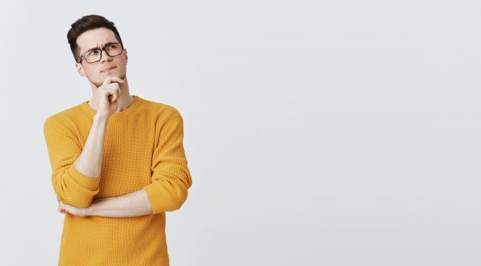 serious thoughtful man making assumption looking right thinking 1 1 scaled