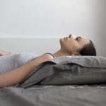 medium shot woman laying pillow 1 1