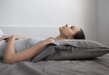 medium shot woman laying pillow 1 1