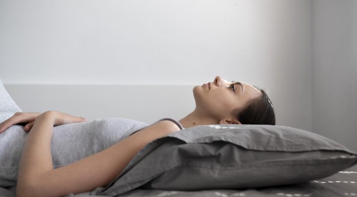 medium shot woman laying pillow 1 1