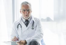 elderly therapist making notes 1 scaled