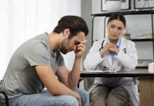 side view sad man doctor s appointment 1 1 scaled