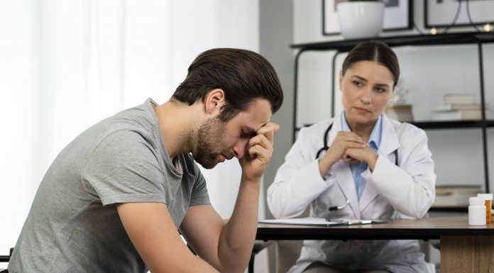 side view sad man doctor s appointment 1 1 scaled